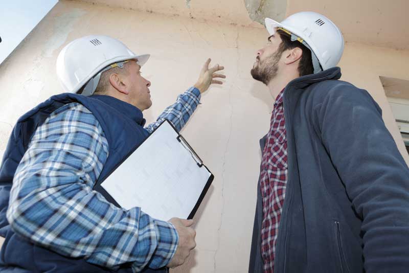 building-inspection-by-men-in-hard-hats