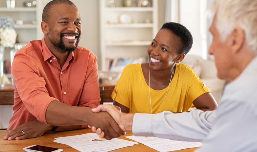 man-shaking-hands-with-insurance-agent